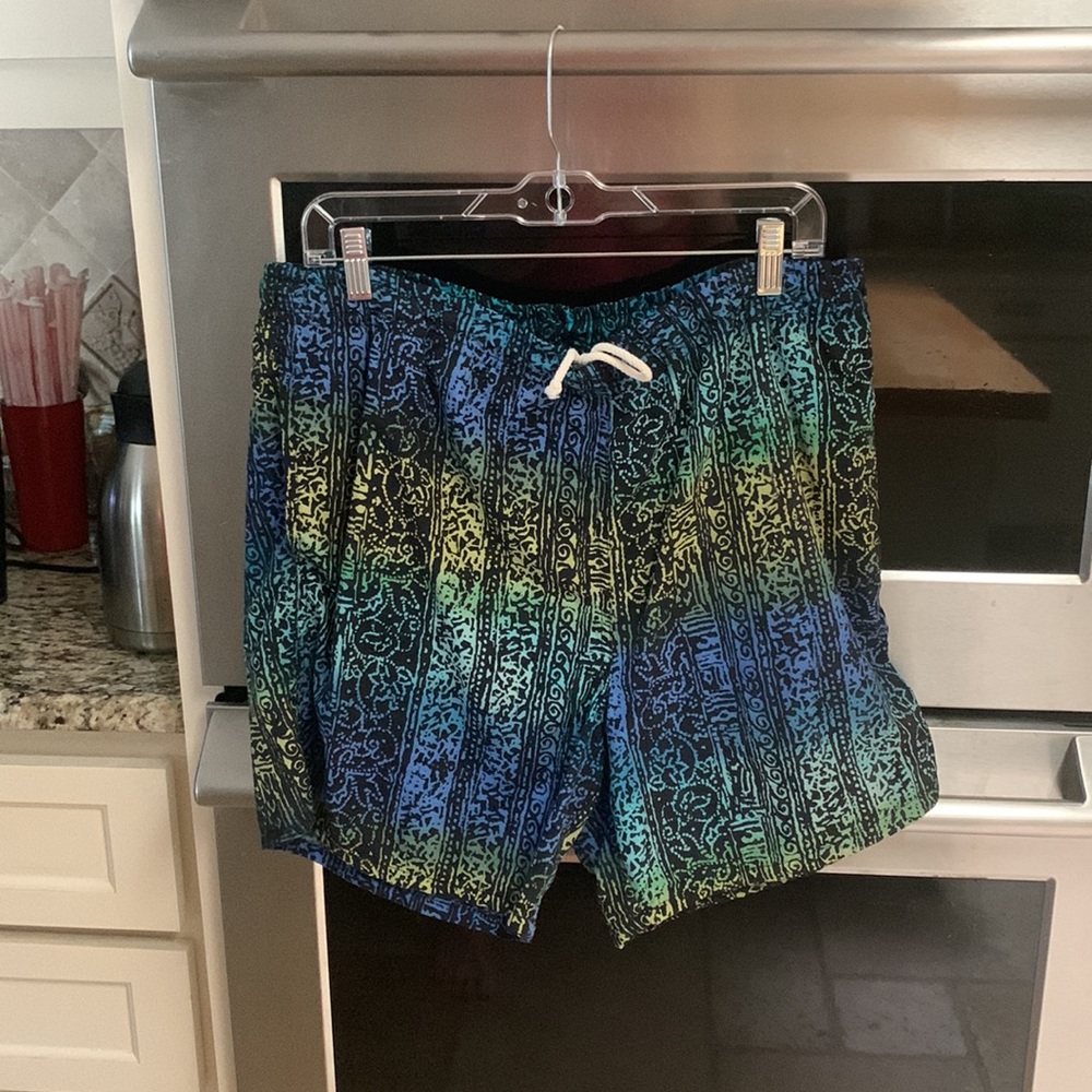 Gitano size large swimsuit with side pockets.